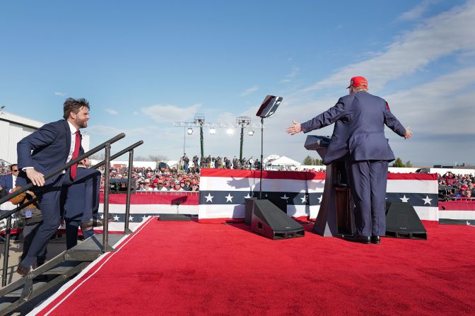 Vance steps on stage as Trump introduces him during a rally in Vandalia, Ohio, in March 2024.