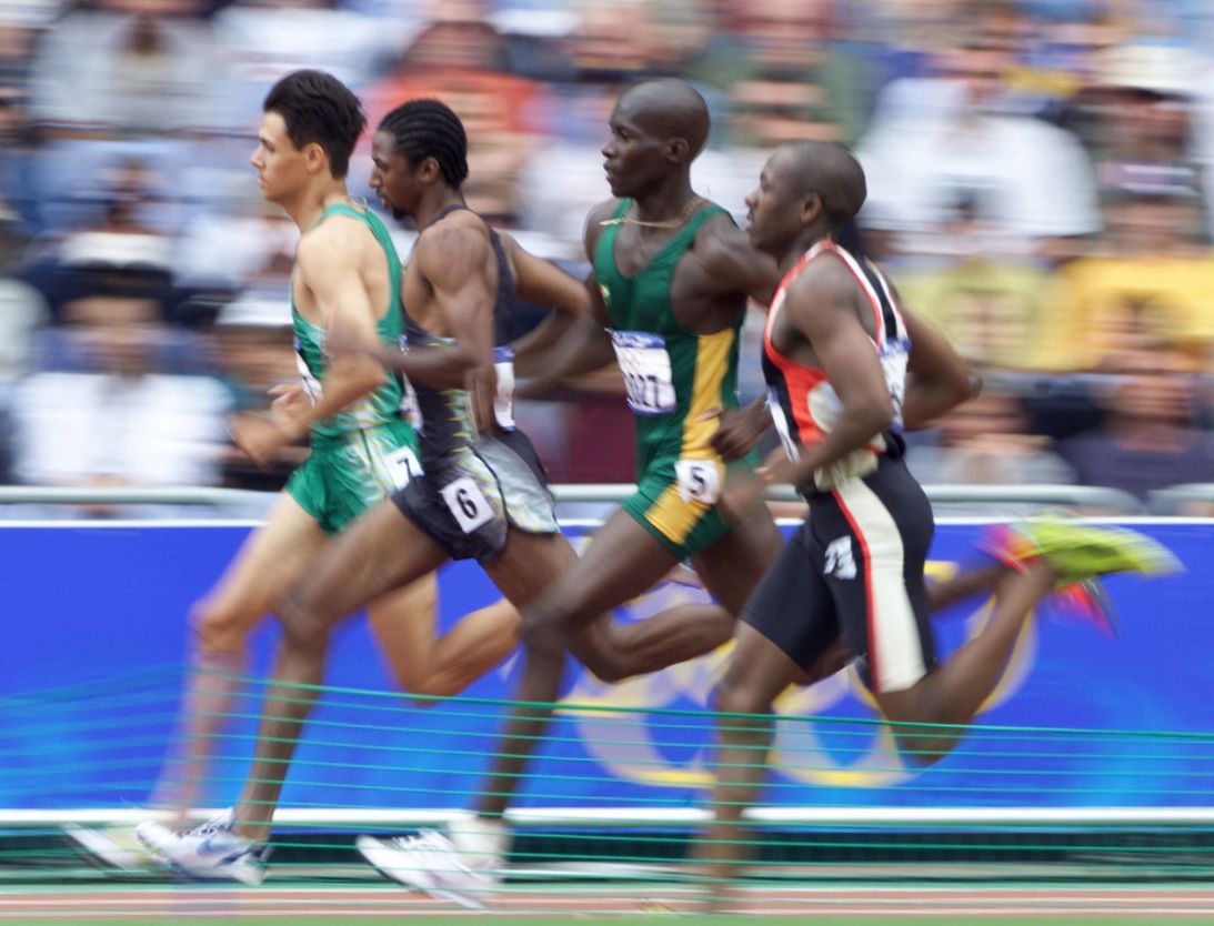 Runners compete in heat four of the men's 800m round one qualifying heat at the Sydney Olympic Games on September 23, 2000. From left are South Africa's Johan Botha, Jamaica's Marvin Watts, Guyana's Ian Roberts and Zimbabwe's Crispen Mutakanyi.