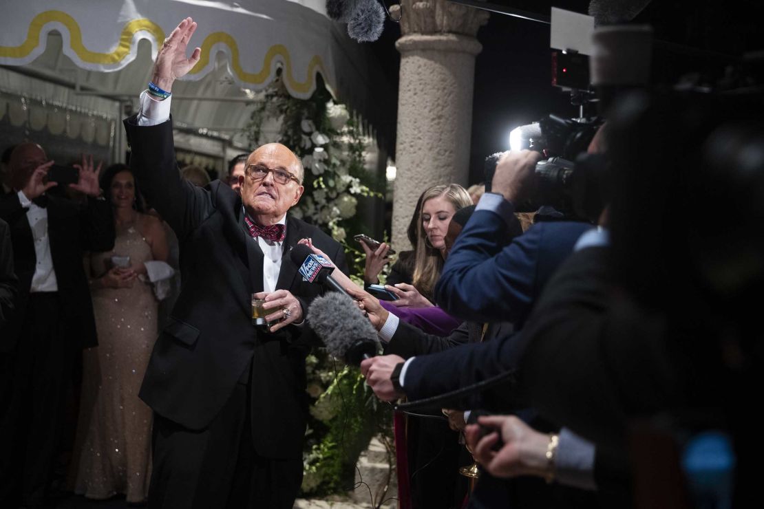 Former New York Mayor Rudy Giuliani, an attorney for President Donald Trump, speaks to reporters as he arrives for a New Year's Eve party hosted by President Donald Trump at his Mar-a-Lago property, Tuesday, Dec. 31, 2019, in Palm Beach, Florida.