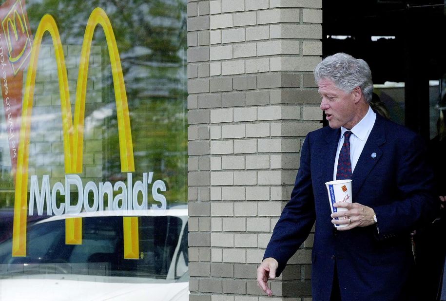 Clinton leaves a McDonald's in Monroe Michigan, in August 2000. The day before, he spoke at the Democratic National Convention, passing the Democratic Party's symbolic torch to Vice President Al Gore.