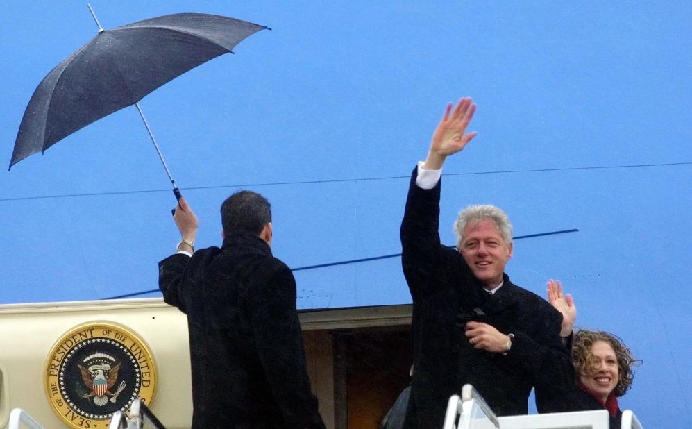 Clinton and his daughter, Chelsea, wave as they leave Washington, DC, following George W. Bush's inauguration in January 2001.
