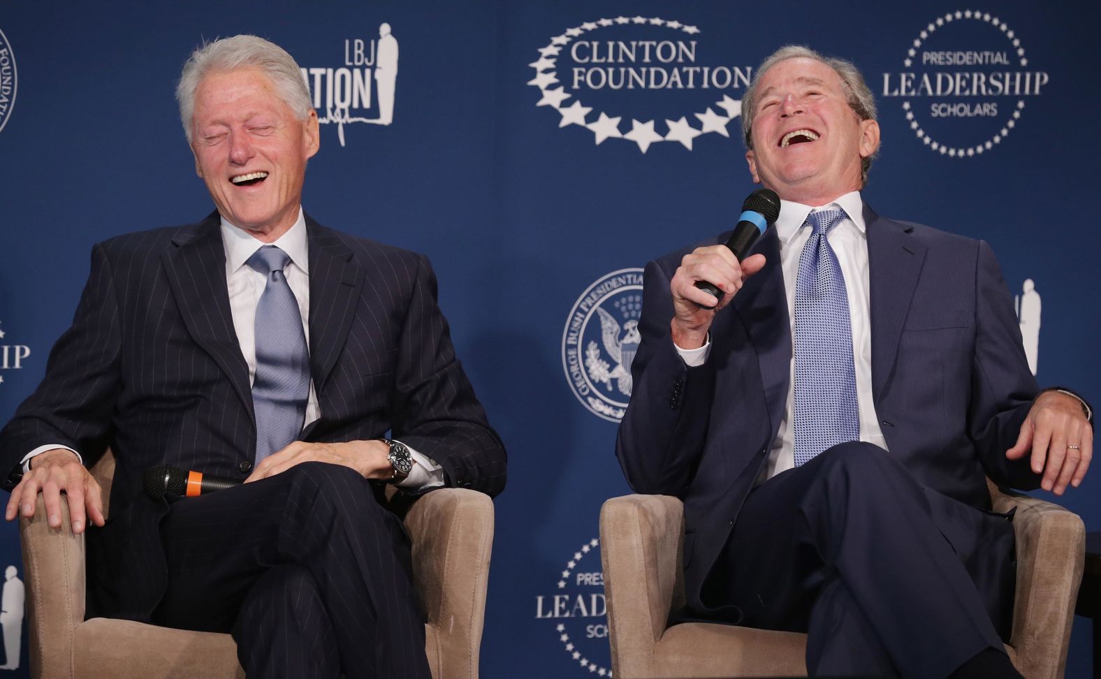 Clinton and former President George W. Bush share a laugh during a September 2014 event launching the Presidential Leadership Scholars program at the Newseum in Washington, DC.