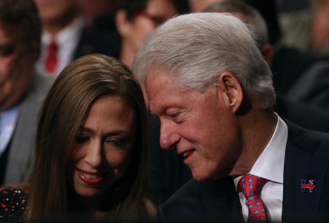 Clinton talks to his daughter, Chelsea, before the start of one of Hillary's presidential debates in October 2016.