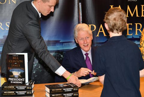 In June 2018, Clinton signs copies of his novel "The President Is Missing," which he co-wrote with James Patterson.