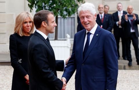 French President Emmanuel Macron and his wife, Brigitte, welcome Clinton for a lunch in Paris in September 2019. Clinton was in France to pay tribute to the late French President Jacques Chirac.