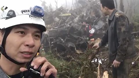 In this image made from video, emergency teams work at the crash site of a military helicopter in the mountains of Yilan, northeastern Taiwan, on Thursday, January 2, 2020.