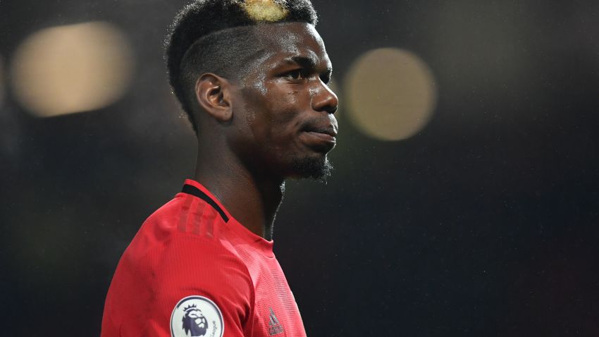 Manchester United's French midfielder Paul Pogba leaves the pitch after the English Premier League football match between Manchester United and Newcastle United at Old Trafford in Manchester, north west England, on December 26, 2019. - Manchester United won the game 4-1. (Photo by Paul ELLIS / AFP) / RESTRICTED TO EDITORIAL USE. No use with unauthorized audio, video, data, fixture lists, club/league logos or 'live' services. Online in-match use limited to 120 images. An additional 40 images may be used in extra time. No video emulation. Social media in-match use limited to 120 images. An additional 40 images may be used in extra time. No use in betting publications, games or single club/league/player publications. /  (Photo by PAUL ELLIS/AFP via Getty Images)
