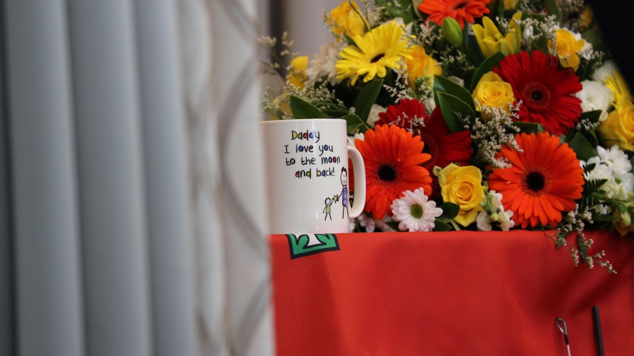A mug placed on the coffin was inscribed with the words: "Daddy I love you to the moon and back!"