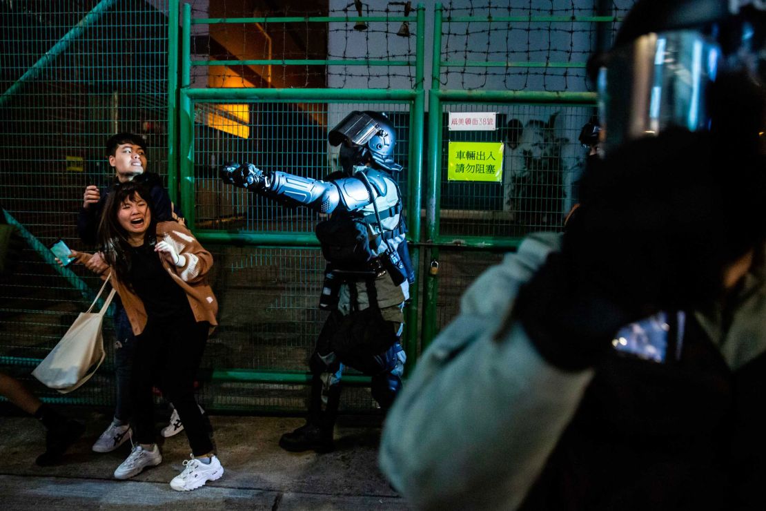 Police arrive to clear pro-democracy protesters in the Kowloon district of Hong Kong on New Year's Eve.
