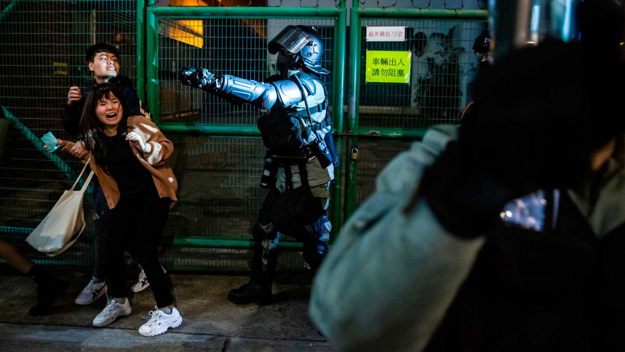 Police arrive to clear pro-democracy protesters in the Kowloon district of Hong Kong on New Year's Eve.