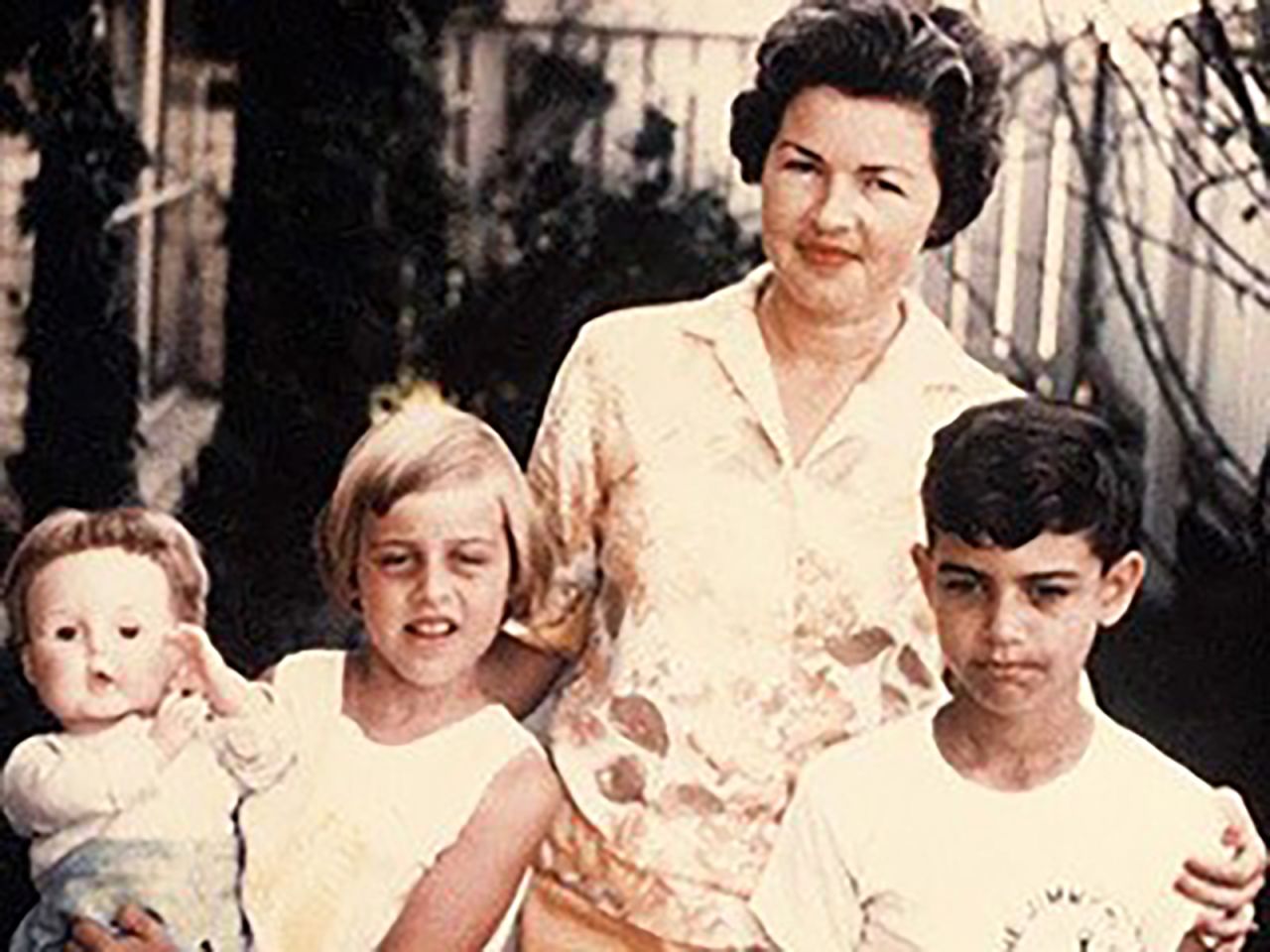 A young DeGeneres poses for a family photo.