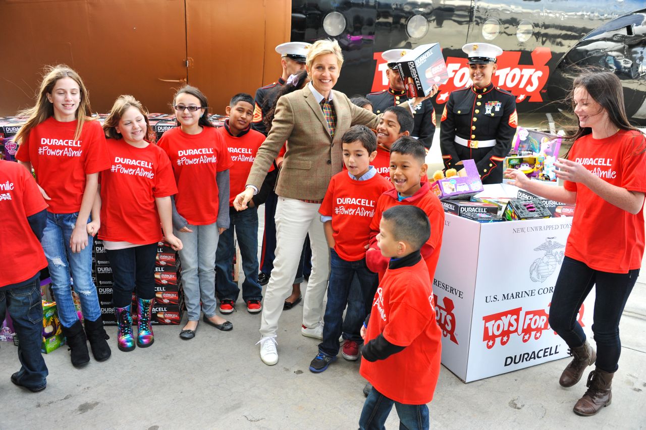 DeGeneres, US Marines and children attend the launch of Duracell's "Power a Smile" program in 2013.