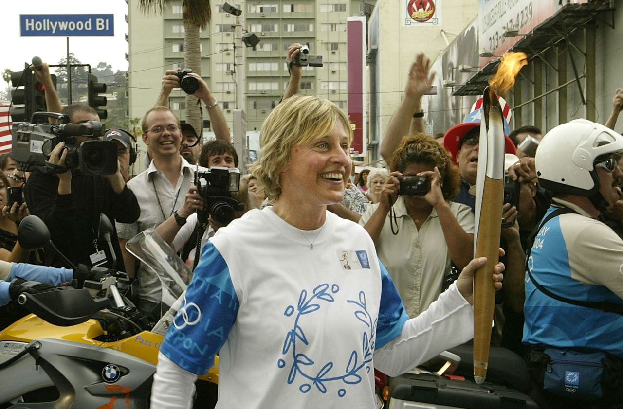DeGeneres carries the Olympic torch in Los Angeles in June 2004.