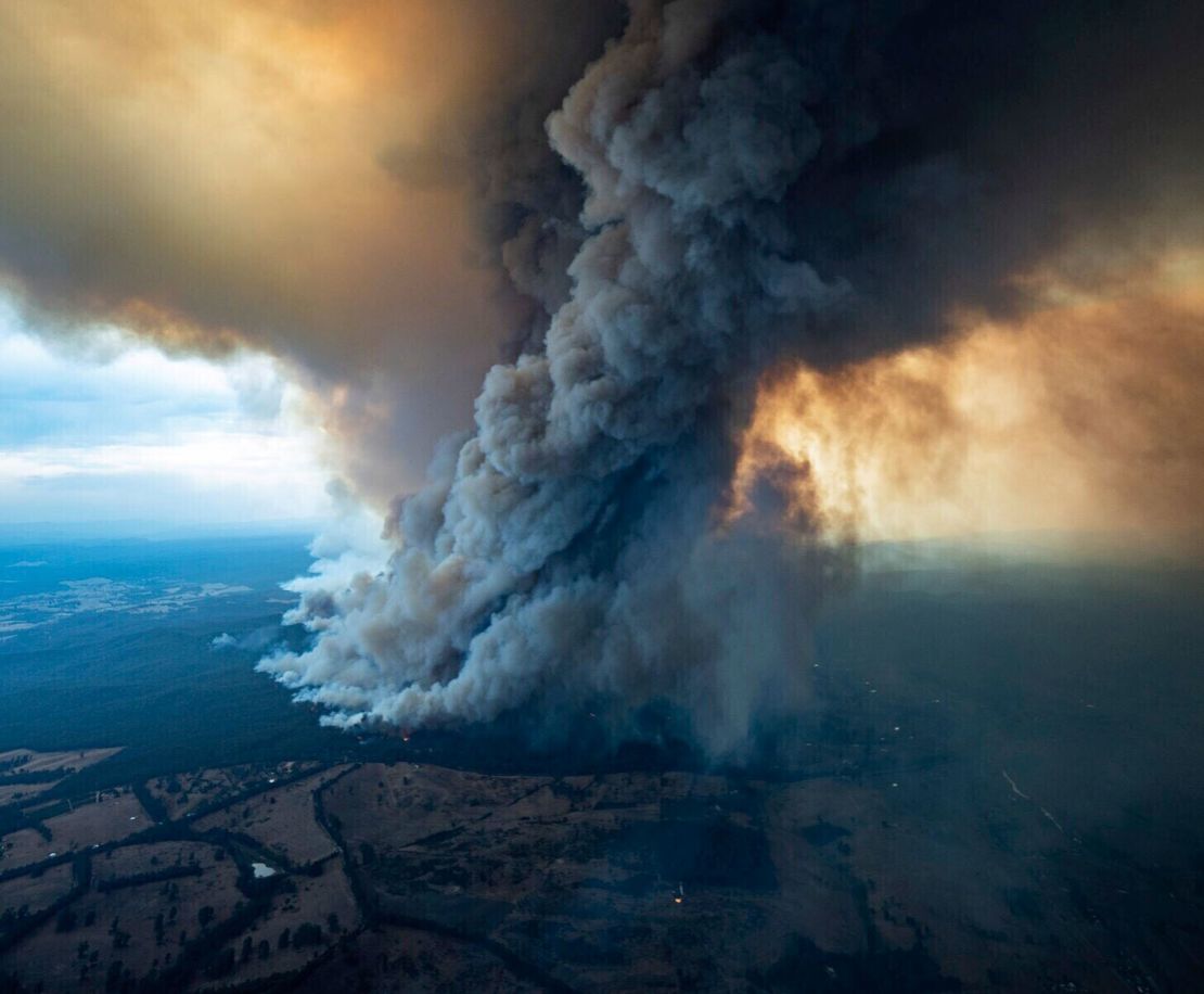 A massive cloud of smoke rises from wildfires burning in East Gippsland, Victoria, Australia.