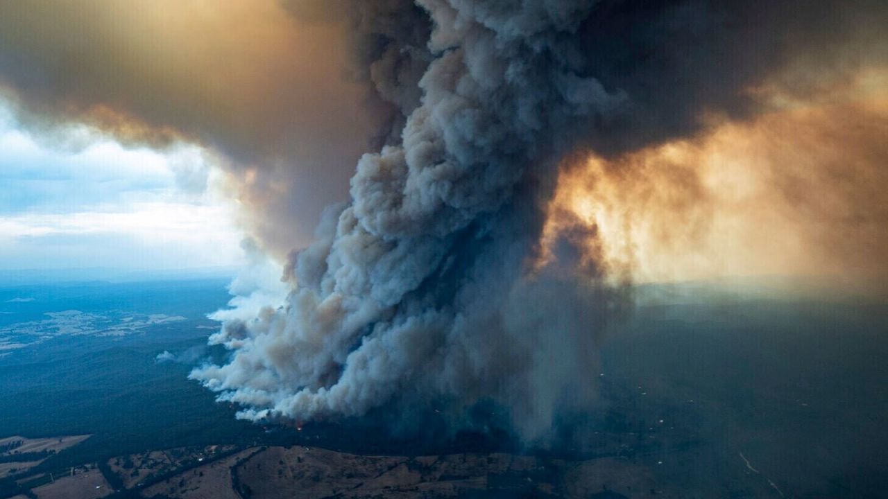 A massive cloud of smoke rises from wildfires burning in East Gippsland, Victoria, Australia.