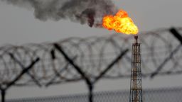 Flames rise from the burning of excess hydrocarbons at the Hammar Mushrif new Degassing Station Facilities site inside the Zubair oil and gas field, north of the southern Iraqi province of Basra on May 9, 2018. (Photo by HAIDAR MOHAMMED ALI / AFP)        (Photo credit should read HAIDAR MOHAMMED ALI/AFP via Getty Images)