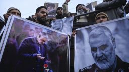 Protesters shout slogans against the United States and Israel as they hold posters with the image of top Iranian commander Qasem Soleimani, who was killed in a US airstrike in Iraq, and Iranian President Hassan Rouhani during a demonstration in the Kashmiri town of Magam on January 3, 2020. - Hundreds of people in Indian Kashmir staged "anti-American" demonstrations in the troubled territory on January 3 within hours of US forces killing a top Iranian commander. (Photo by Tauseef MUSTAFA / AFP) (Photo by TAUSEEF MUSTAFA/AFP via Getty Images)