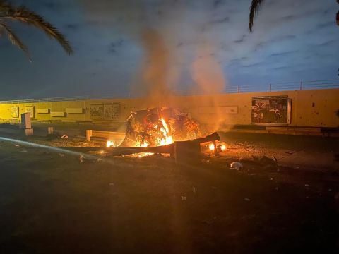 This photo, released by the Iraqi Prime Minister Press Office, shows a burning vehicle at the Baghdad International Airport following the US airstrike that killed Gen. Qasem Soleimani, the head of Iran's elite Quds Force, on January 3.