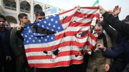 Iranians burn a US flag during a demonstration against American crimes in Tehran on January 3, 2020 following the killing of Iranian Revolutionary Guards Major General Qasem Soleimani in a US strike on his convoy at Baghdad international airport. - Iran warned of "severe revenge" and said arch-enemy the United States bore responsiblity for the consequences after killing one of its top commanders, Qasem Soleimani, in a strike  outside Baghdad airport. (Photo by ATTA KENARE / AFP) (Photo by ATTA KENARE/AFP via Getty Images)