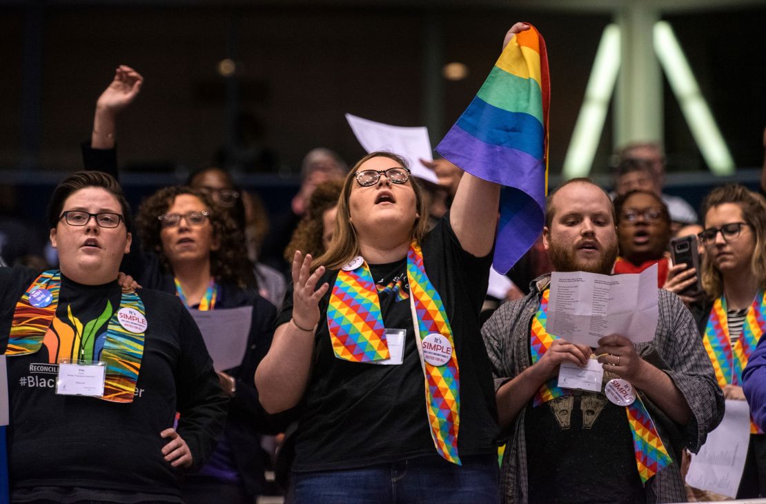 Shelby Ruch-Teegarden, center, joins other protesters during the United Methodist Church's special session of its General Conference in St. Louis on February 26, 2019. 