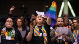 Shelby Ruch-Teegarden, center, of Garrett-Evangelical Theological Seminary joins other protestors during the United Methodist Church's special session of the general conference in St. Louis, Tuesday, Feb. 26, 2019. America's second-largest Protestant denomination faces a likely fracture as delegates at the crucial meeting move to strengthen bans on same-sex marriage and ordination of LGBT clergy. (AP Photo/Sid Hastings)
