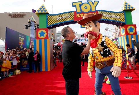 Hanks poses with his "Toy Story" character Woody at the premiere of "Toy Story 4" in June 2019.