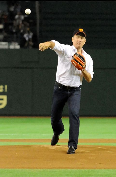 Hanks throws out the ceremonial first pitch before a pro baseball game in Tokyo in 2009.