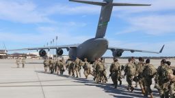 This handout picture released by the US Army shows paratroopers assigned to the 2nd Battalion, 504th Parachute Infantry Regiment, 1st Brigade Combat Team, 82nd Airborne Division, deploy from Pope Army Airfield, North Carolina on January 1, 2020. - Paratroopers from 2nd Battalion, 504th Parachute Infantry Regiment, 1st Brigade Combat Team, 82nd Airborne Division were activated and deployed to the U.S. Central Command area of operations in response to recent events in Iraq.