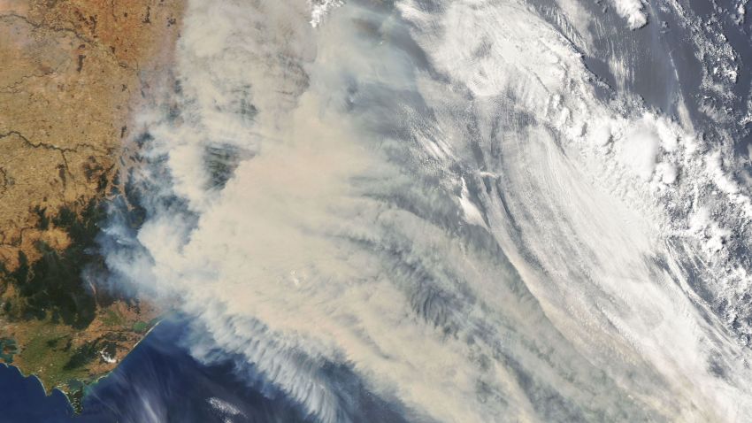 Thick smoke blankets southeastern Australia on January 1, 2020. The smoke has a tan color, while clouds are bright white.