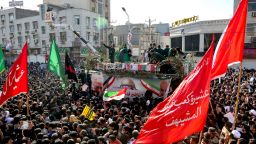 In this photo provided by The Iranian Students News Agency, ISNA, flag draped coffins of Gen. Qassem Soleimani and his comrades who were killed in Iraq in a U.S. drone strike, carried on a truck surrounded by mourners during their funeral in southwestern city of Ahvaz, Iran, Sunday, Jan. 5, 2020. The body of Soleimani arrived Sunday in Iran to throngs of mourners, as U.S. President Donald Trump threatened to bomb 52 sites in the Islamic Republic if Tehran retaliates by attacking Americans. (Alireza Mohammadi/ISNA via AP)