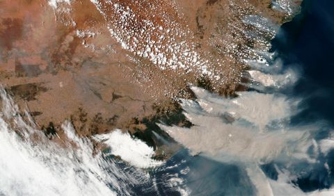 This satellite image provided by NASA on Saturday, January 4, shows smoke from fires burning in Victoria and New South Wales.