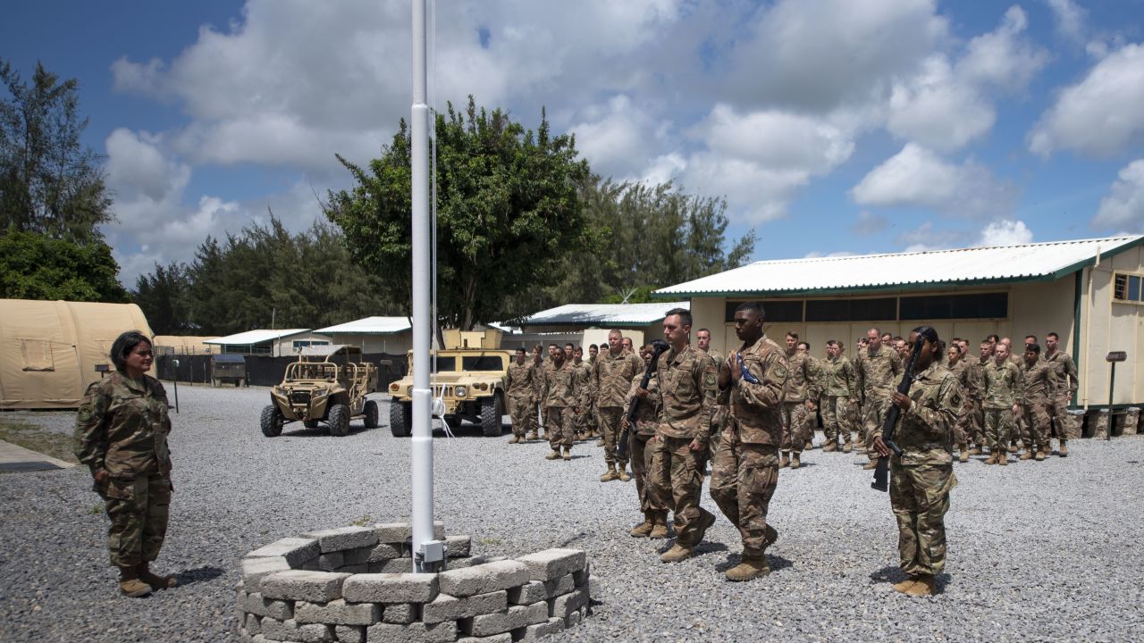 US Air Force airmen from the 475th Expeditionary Air Base Squadron conduct a flag-raising ceremony at Camp Simba, Kenya, on August 26, 2019. 
