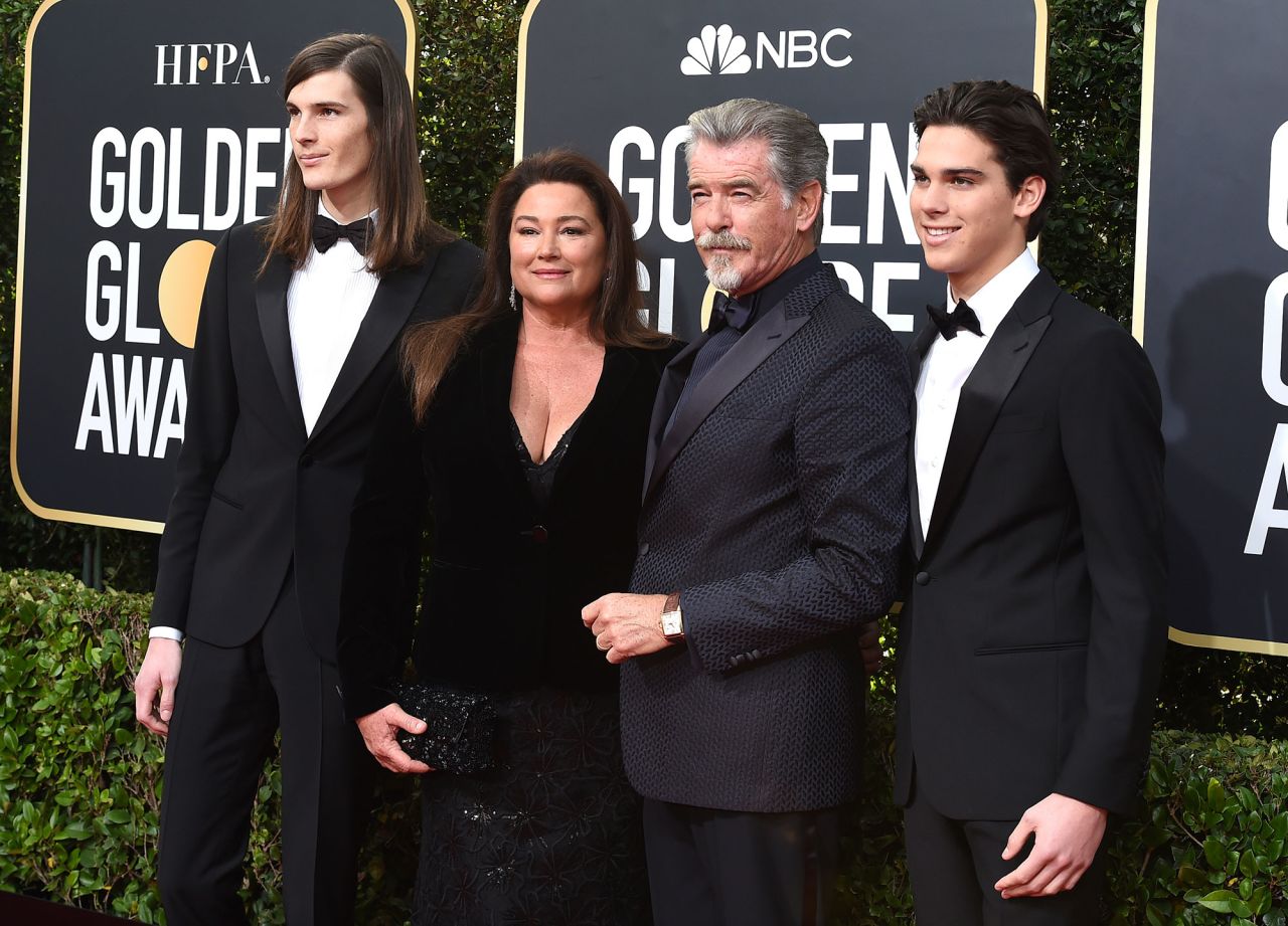 Pierce Brosnan and Keely Shaye Smith are joined by their sons Dylan, left, and Paris. Dylan and Paris Brosnan are this year's Golden Globe ambassadors.