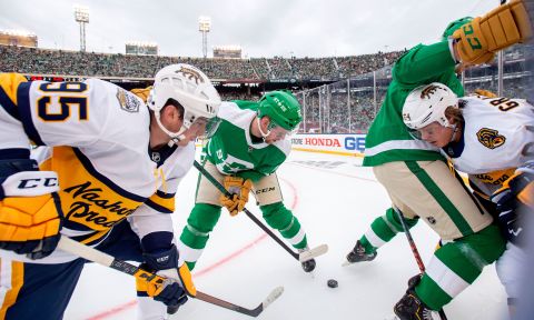 Players from the Nashville Predators and the Dallas Stars battle for the puck during the NHL Winter Classic on Wednesday, January 1. The annual outdoor game was played at the Cotton Bowl in Dallas.