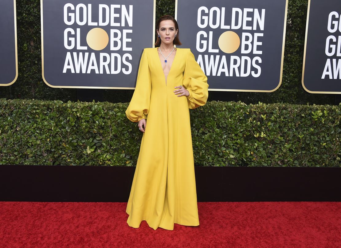 Star of "The Politician," Zoey Deutch, shines in a bright yellow Fendi jumpsuit and more than 100 carats of diamonds and sapphires.