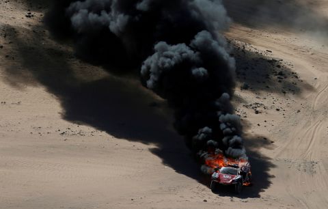 The rally car of Romain Dumas and Alexandre Winocq catches fire during the first stage of the Dakar Rally on Sunday, January 5. Neither Dumas or Winocq were hurt. The Dakar Rally is taking place in Saudi Arabia this year. 