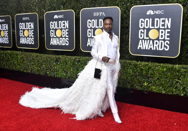 Billy Porter strikes a pose in an all-white suit by New York designer Alex Vinash, complete with a huge white feather train. The actor paired the outfit with jewels by Tiffany & Co. and Jimmy Choo shoes.