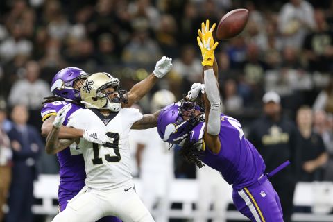 Minnesota's Anthony Harris intercepts a pass intended for New Orleans wide receiver Ted Ginn Jr. during an NFL playoff game on Sunday, January 5. Minnesota won 26-20 in overtime.