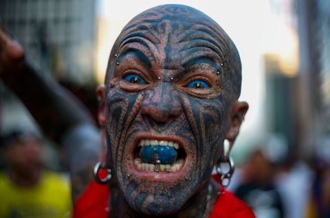 A tattooed runner prepares for the 15-kilometer St. Silvester road race in Sao Paulo, Brazil, on Tuesday, December 31.