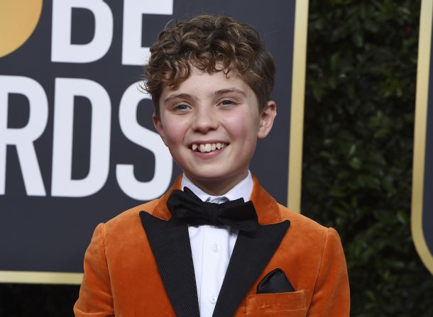 Star of "Jojo Rabbit," 12-year-old Roman Griffin Davis, showed the adults how it's done in a dashing orange tuxedo jacket.