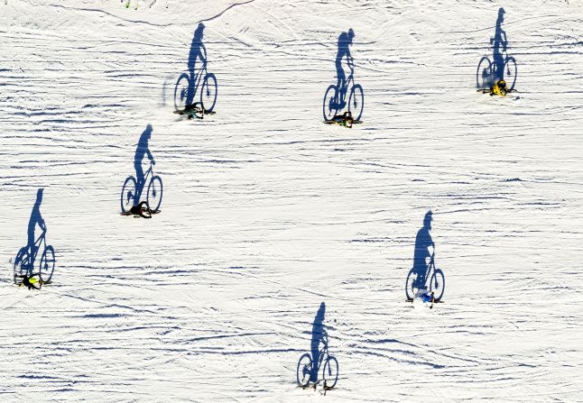 This aerial photo, taken with a drone, shows cyclists taking part in the St. Sylvestre Grand Prix, a mountain bike race in Villars-sur-Ollon, Switzerland, on Tuesday, December 31.