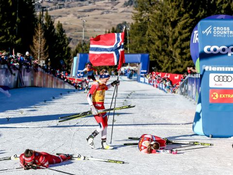 Cross country skiers collapse at the finish line after a World Cup race in Val di Fiemme, Italy, on Sunday, January 5. Norway's Therese Johaug finished first in the women's mass-start event.