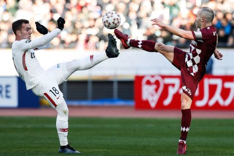 Vissel Kobe's Andres Iniesta, right, competes against Kashima Antlers' Serginho during the Emperor's Cup final in Tokyo on Wednesday, January 1. Vissel Kobe won 2-0.