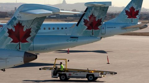 Air Canada planes sit on the tarmac at Montreal-Trudeau International Airport.
