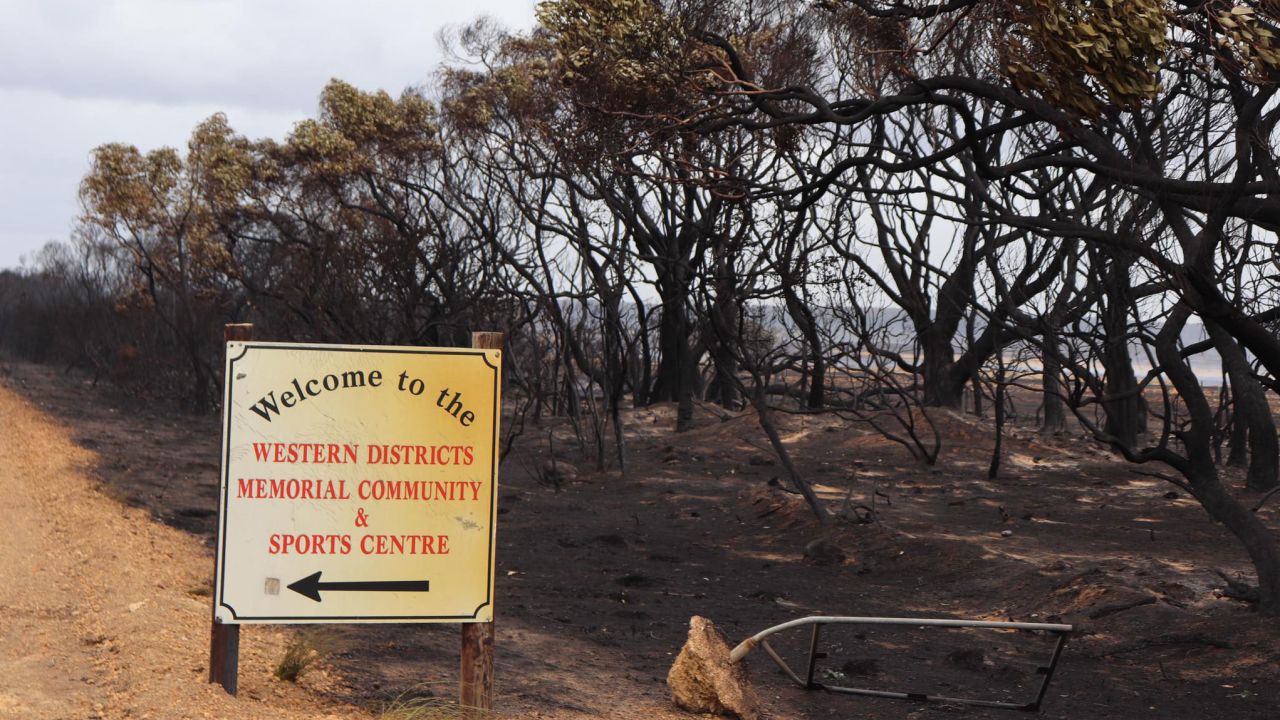 A sign stands next to burned land in Kangaroo Island