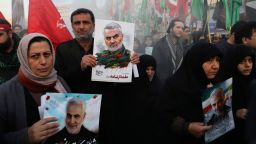 Mourners holding posters of Iranian Gen. Qassem Soleimani attend a funeral ceremony for him and his comrades, who were killed in Iraq in a U.S. drone strike on Friday, at the Enqelab-e-Eslami (Islamic Revolution) Square in Tehran, Iran, Monday, Jan. 6, 2020.