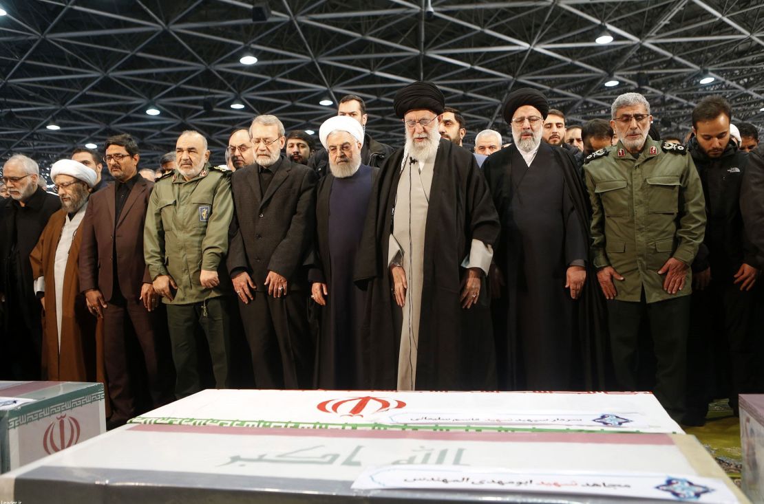 Iranian leaders -- including Supreme Leader Ayatollah Ali Khamenei (fourth from right) and Iranian President Hassan Rouhani (fifth from the right) -- attend Soleimani's funeral ceremony on Monday.