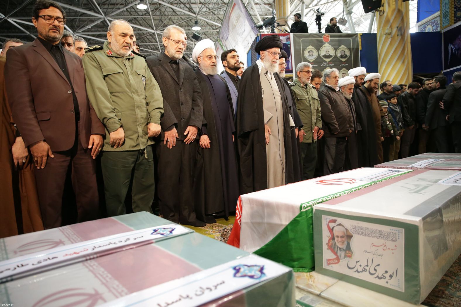 Iranian President Hassan Rouhani, fourth from left, and Supreme Leader Ayatollah Ali Khamenei, fifth from left, attend the funeral in Tehran.