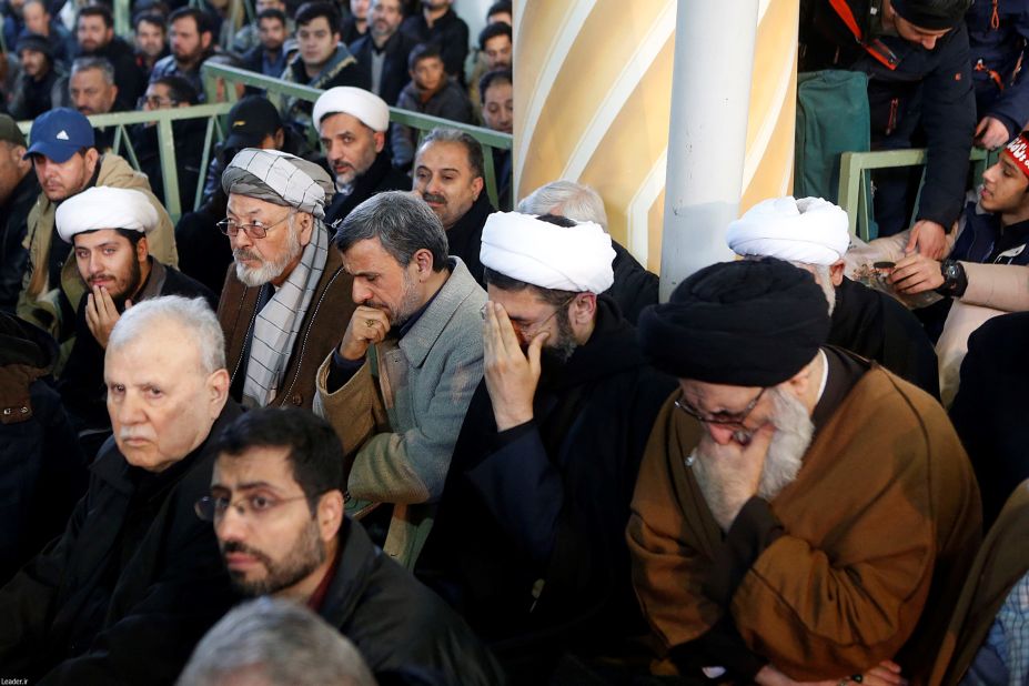 Former Iranian President Mahmoud Ahmadinejad, third from right, attends Soleimani's funeral.