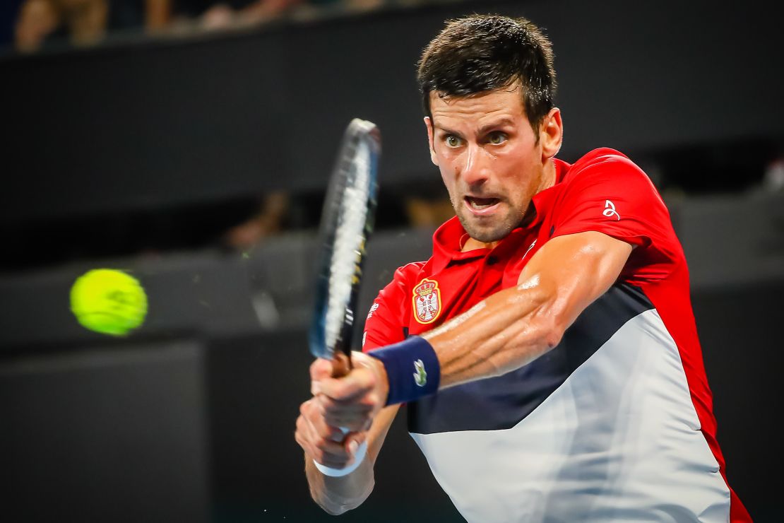 Novak Djokovic hits a return against Gael Monfils during the ATP Cup in Brisbane.